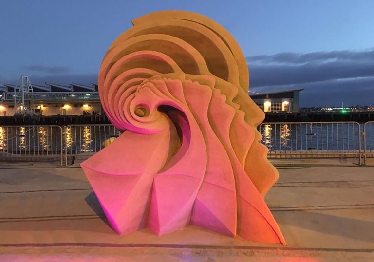 sand sculptures illuminated at night