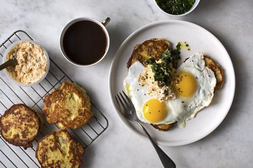 a morning breakfast meal consisting of eggs, pancakes and coffee