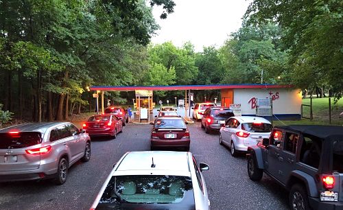 cars lined up at the toll gate