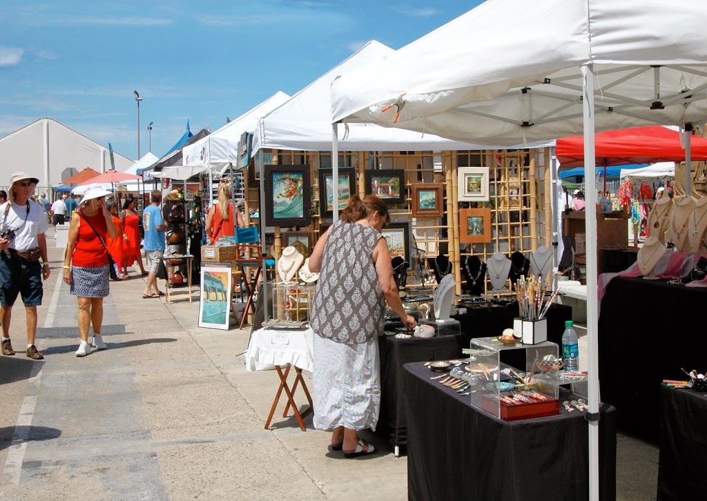 people on sidewalk art exposition