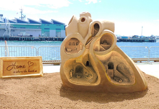 sand sculpture of rusty croft USA-home is where the heart is
