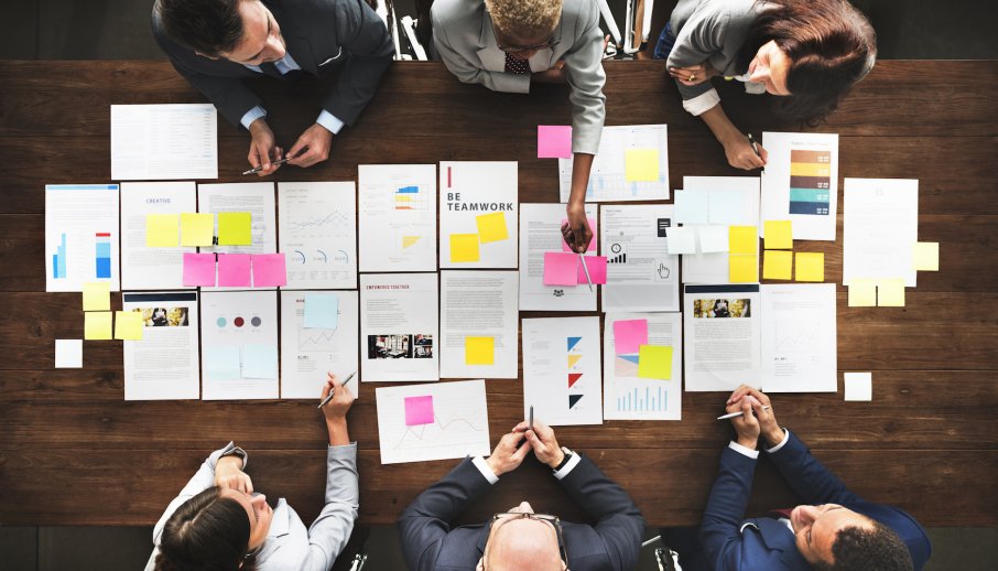 photo of six people having a meeting for marketing