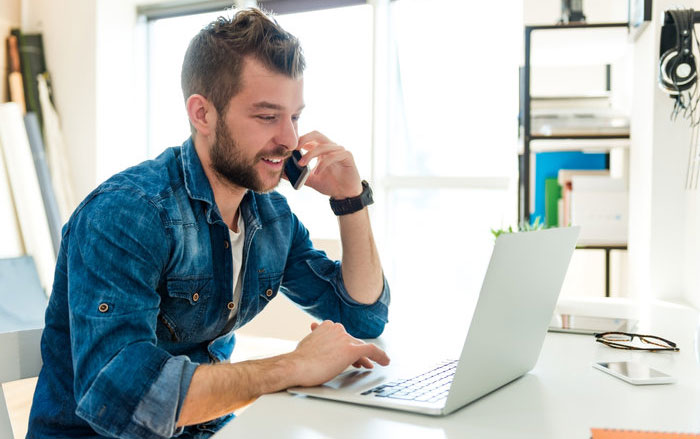 a-man-at-his-home-office-answering-phones