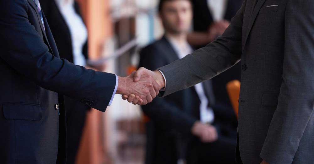 two-men-shaking-hands-closing-a-deal