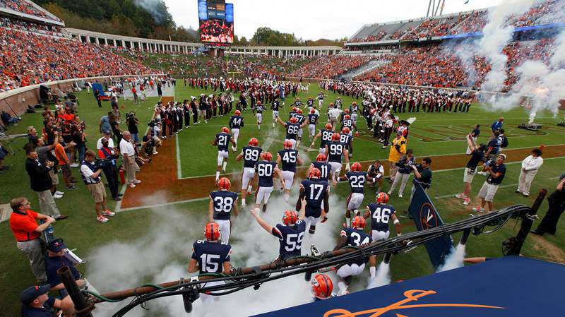 a-football-team-running-onto-the-fields