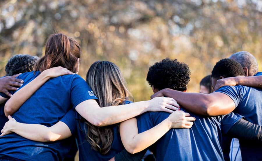 people-hugging-each-other-outside