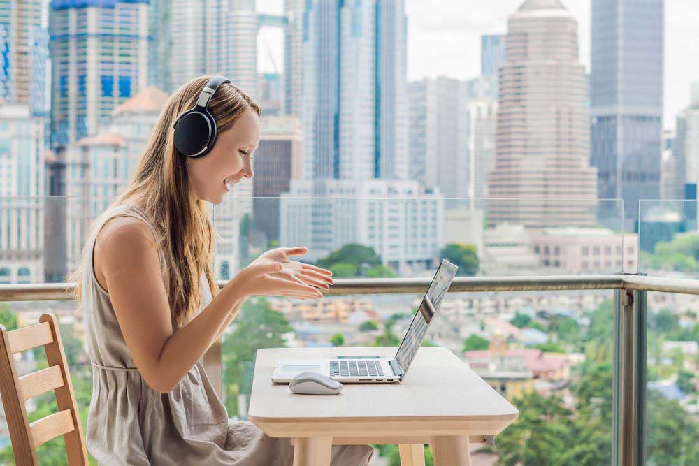 a-woman-on-the-computer-talking-outside