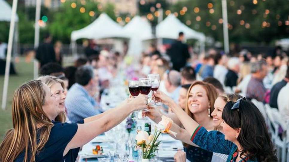 Women-cheering-their-wine-glasses-outside