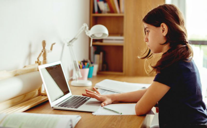 a-student-working-on-her-computer-at-home