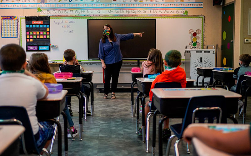 a-teacher-in-classroom-wearing-a-mask