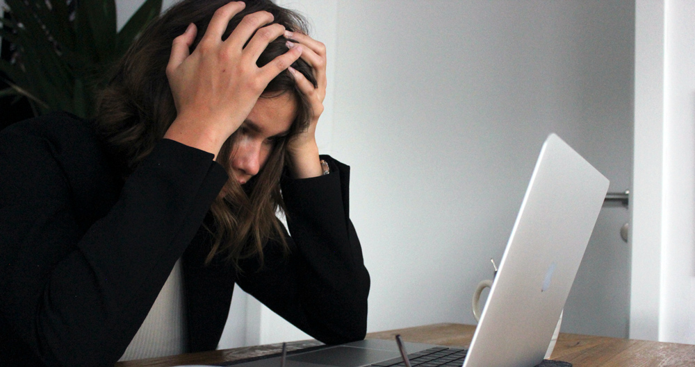 a-person-stressed-out-looking-at-a-computer